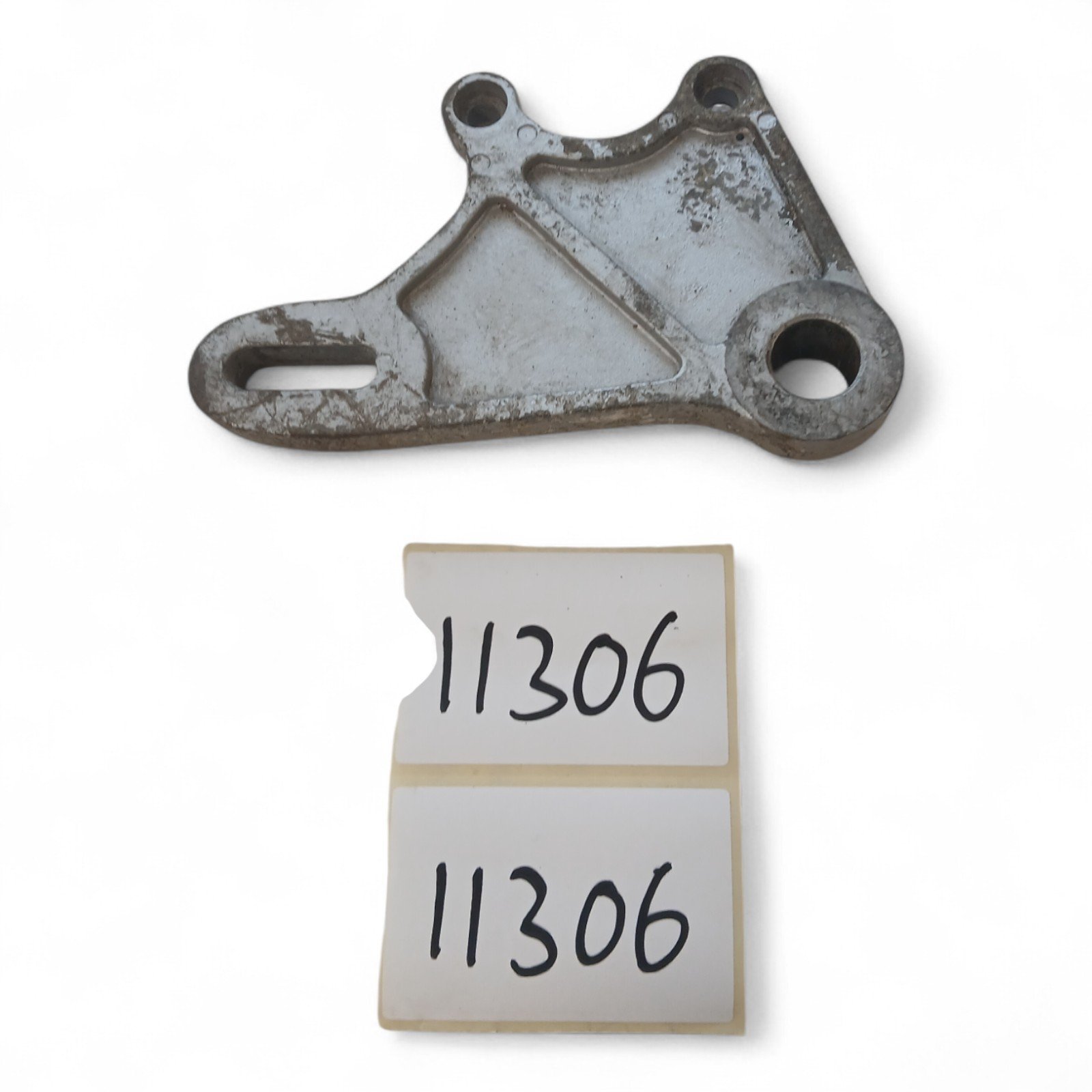 11306_2028129-Photoroom.jpg Aprilia RS125 125 1995-2006 Rear Brake Calliper Bracket OEM - Image 1