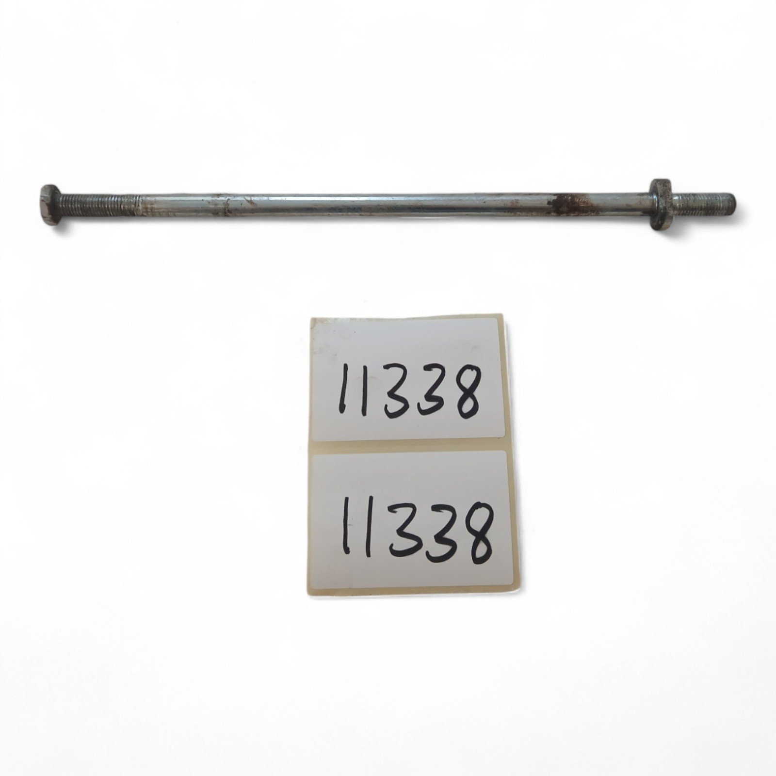 11338_2028129-Photoroom.jpg Baotian BT110-2 110 2008 Swingarm Spindle OEM - Image 1