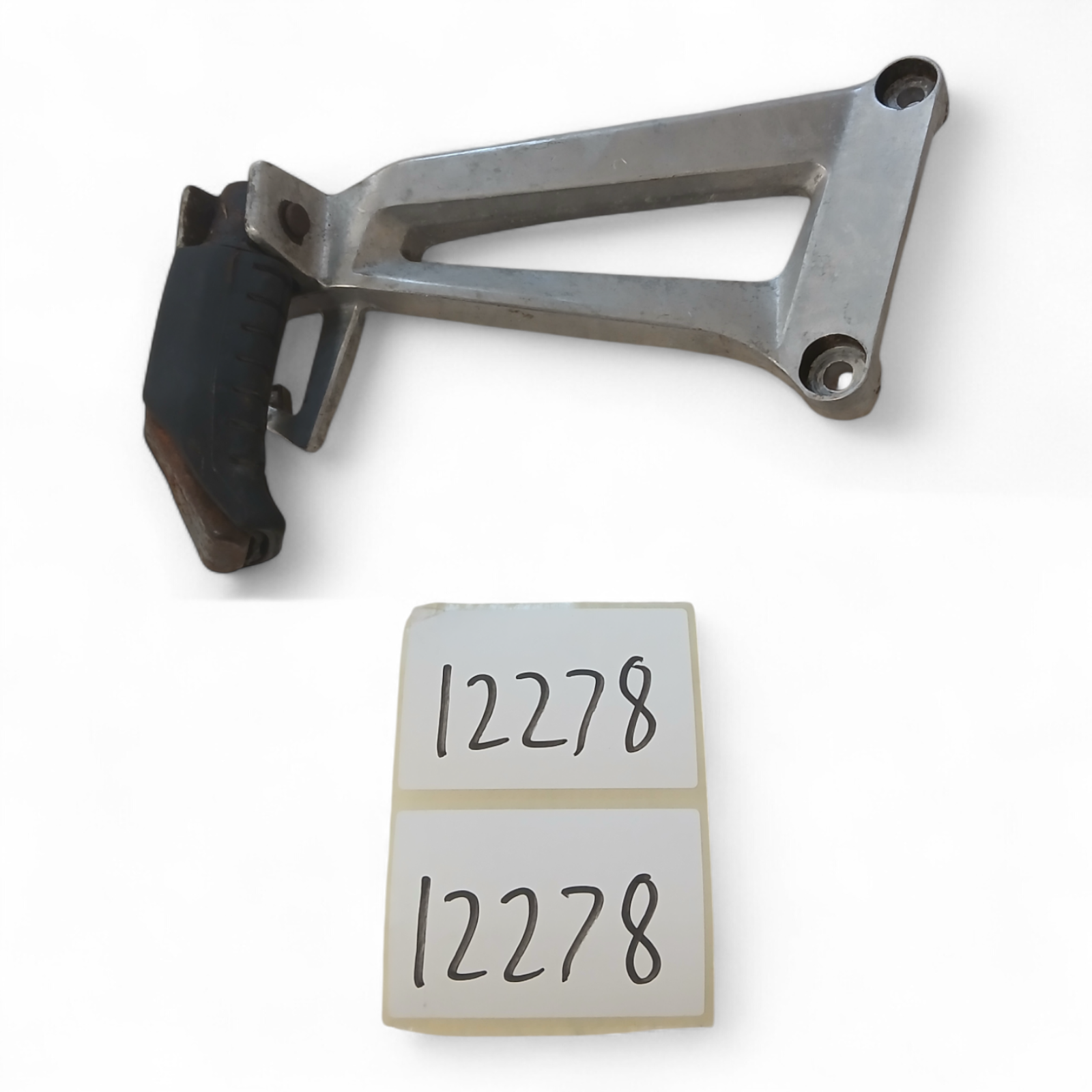 12278_2028129-Photoroom.png Honda CBR125R 125 2004-2006 Rear Right Side Foot Peg Footrest And Bracket OEM - Image 1