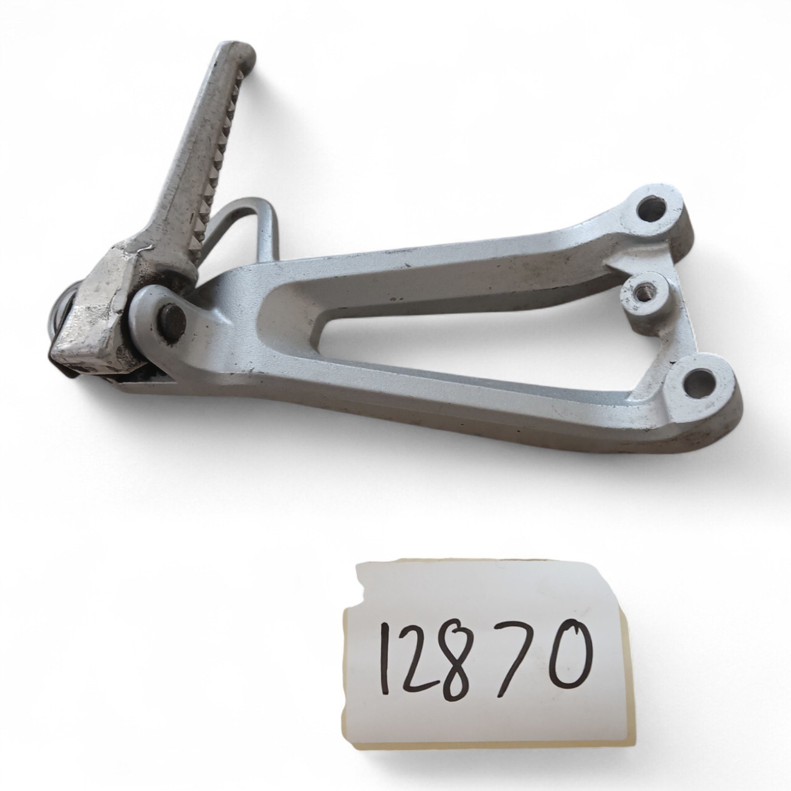 12870_2028129-Photoroom.jpg Honda CBR 600 F / Y 600 2000 Rear Right Foot Peg & Bracket OEM - Image 1