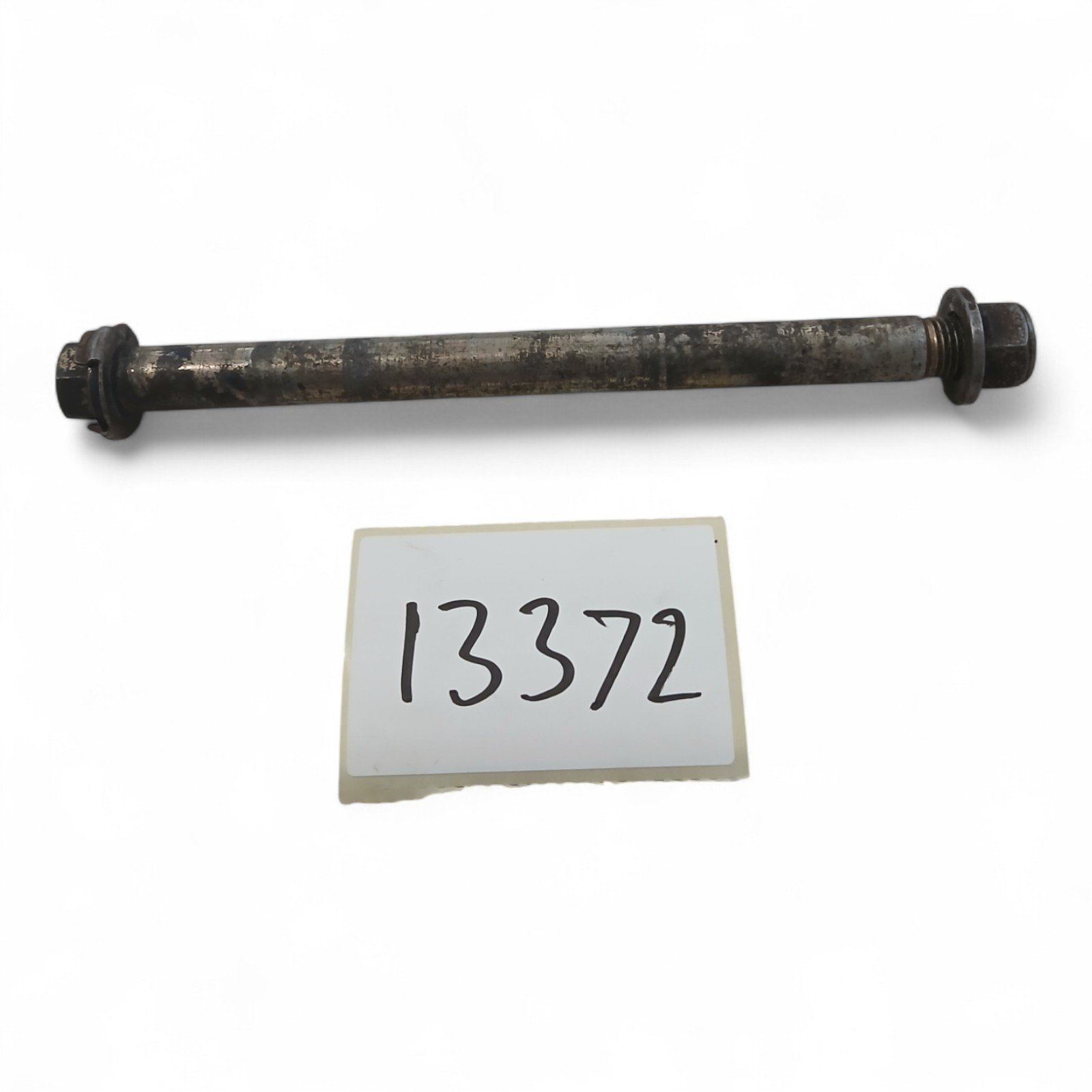 13372_2028129-Photoroom.jpg Yamaha YBR125 125 2006 Front Wheel Spindle Bolt & Nut OEM - Image 1